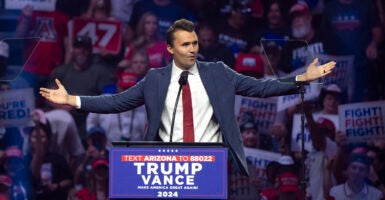 Turning Point USA President Charlie Kirk gestures