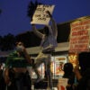 Anti-ICE protesters in front of a vandalized McDonalds in San Francisco.