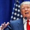 Donald Trump announcing his presidential candidacy in 2015, with American flags as a backdrop.